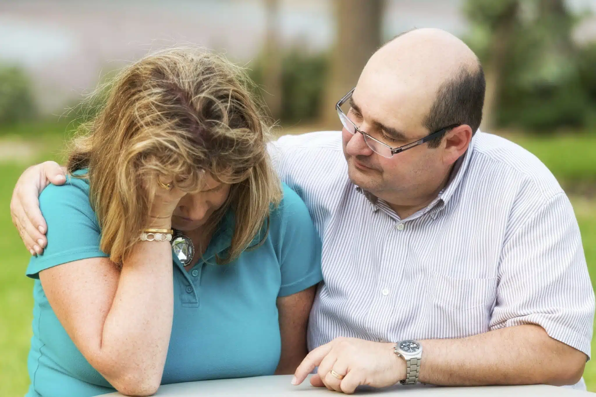 Man consoling woman in distress