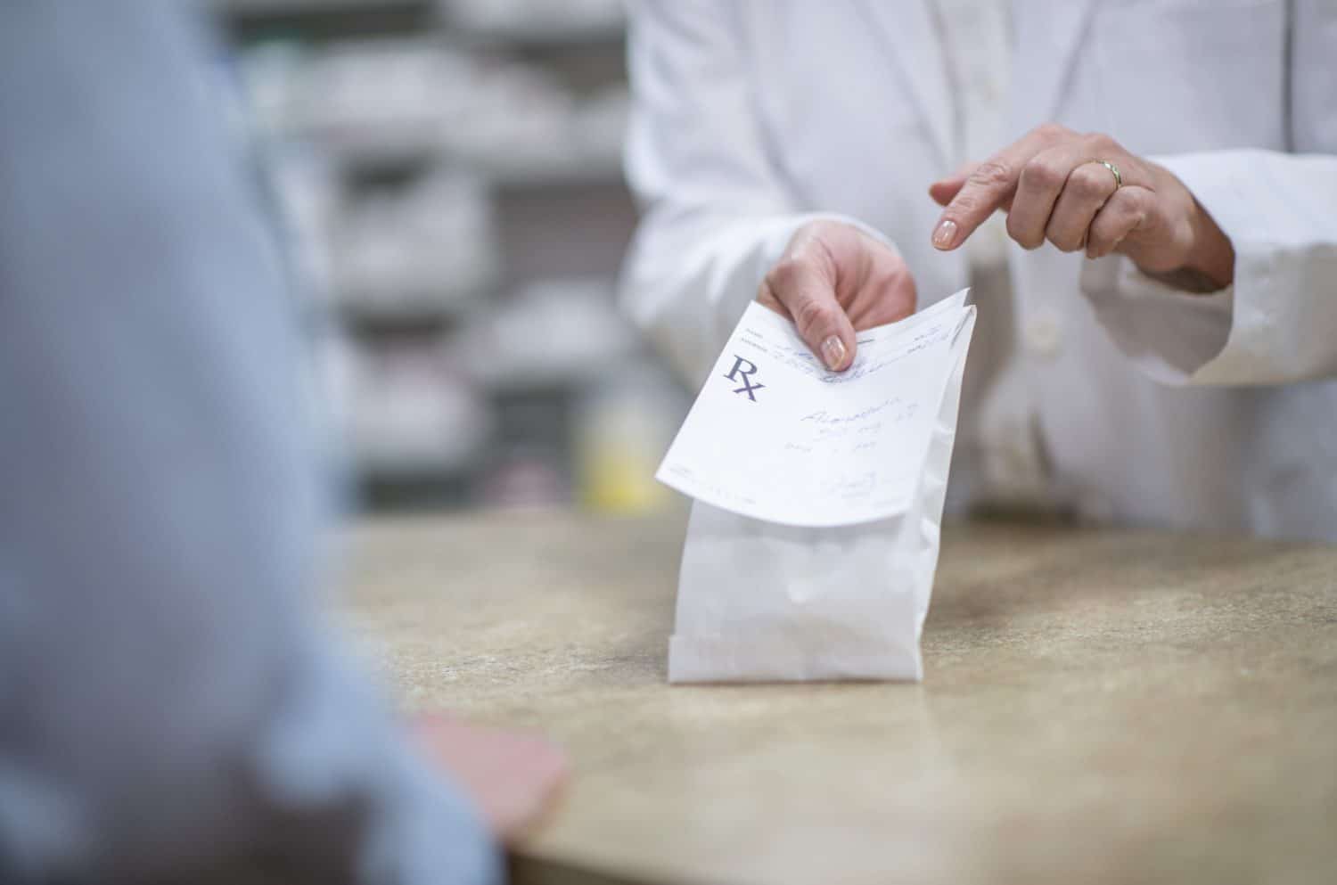 person receiving medication from a pharmacist