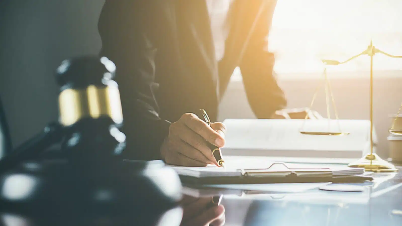 Workers' Compensation Lawyer Signing Legal Documents Stock Photo