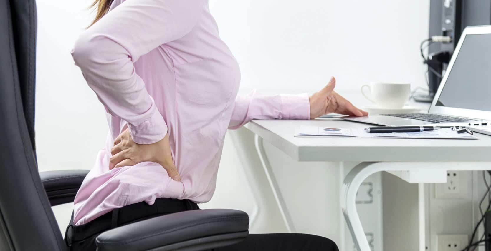 Businesswoman With A Backache Stock Photo