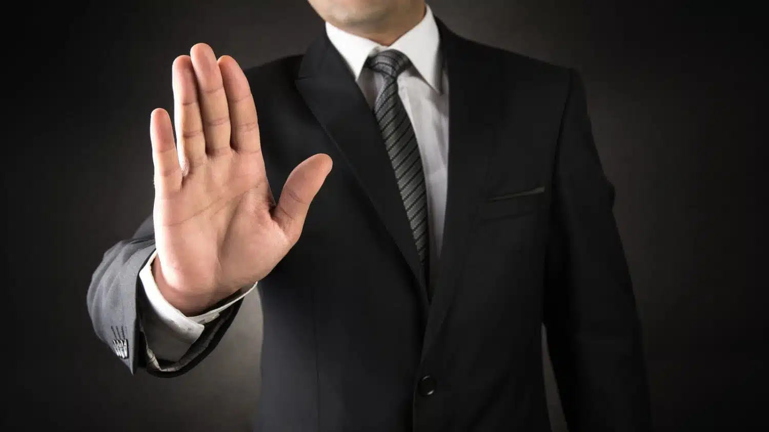 Man showing stop sign stock photo