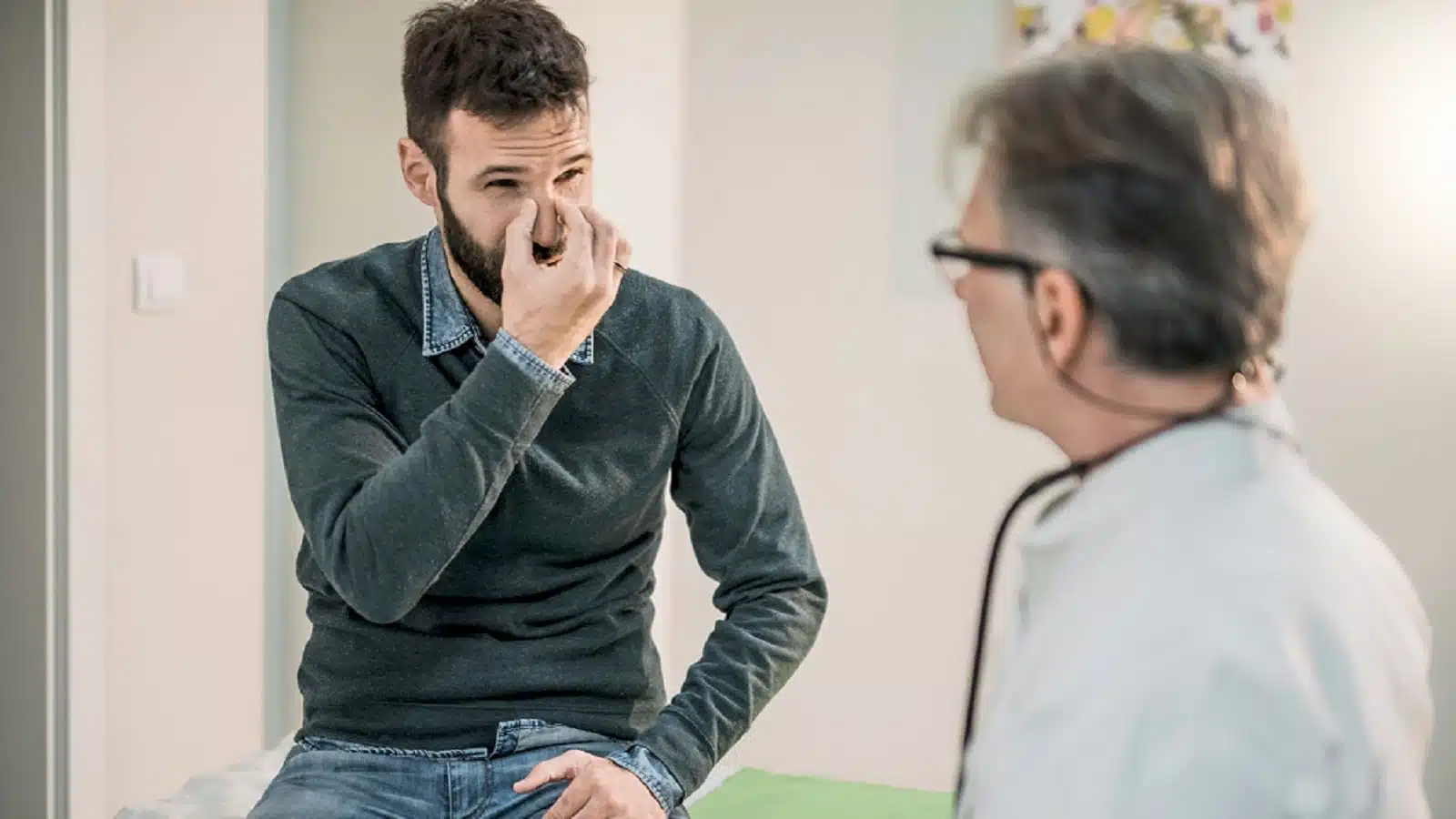 Young Man Receiving Medical Exam Stock Photo