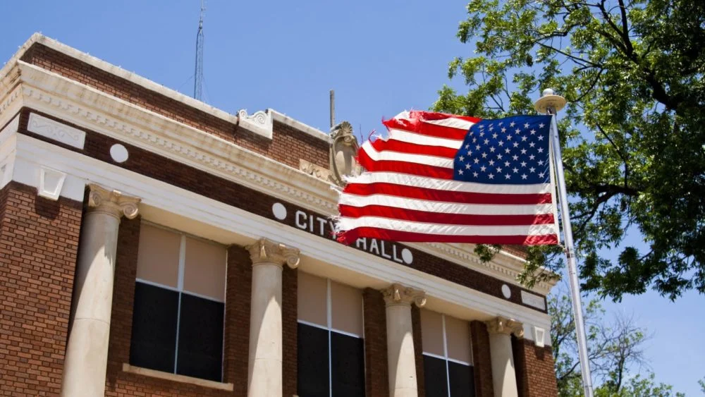 City Hall And American Flag Stock Photo