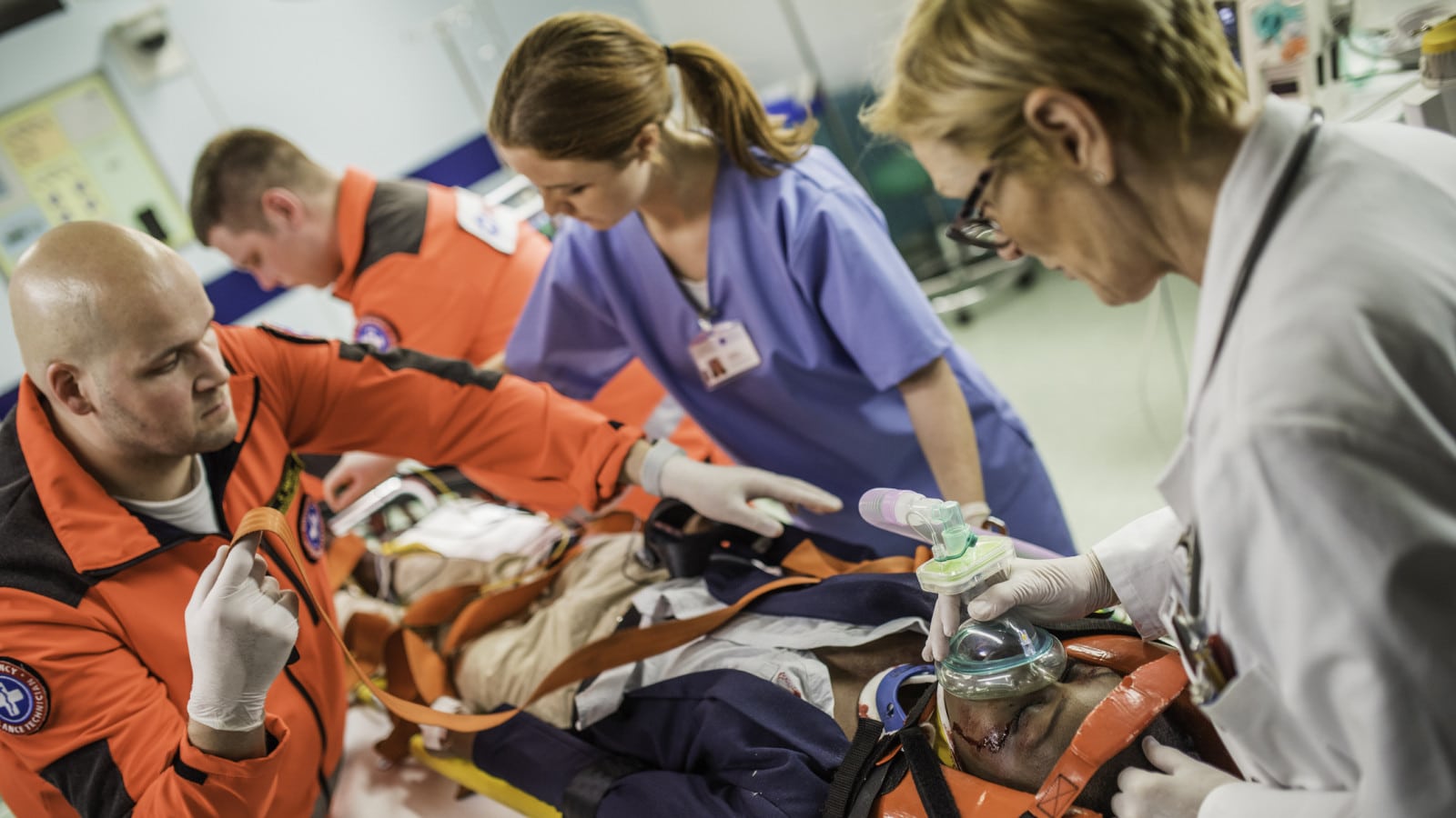 Paramedics Treating Patient Stock Photo