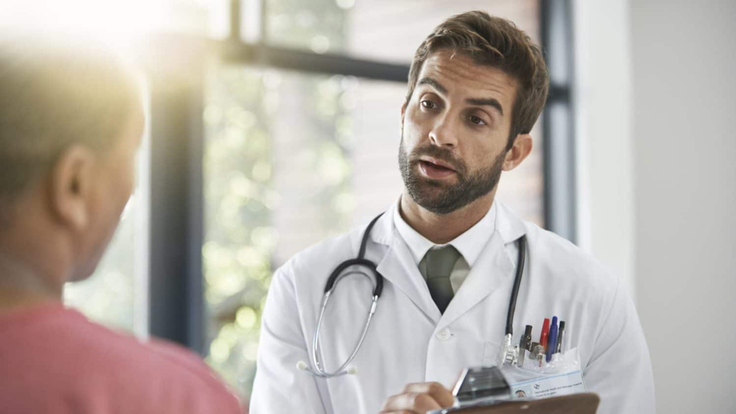 Doctor Talking With Patient Stock Photo