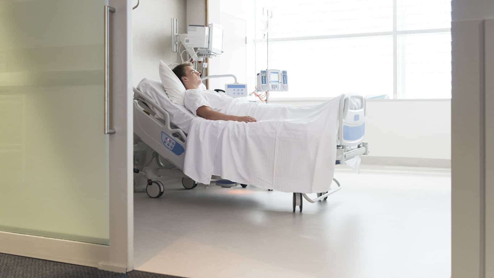 Male Patient Hospital Room Stock Photo