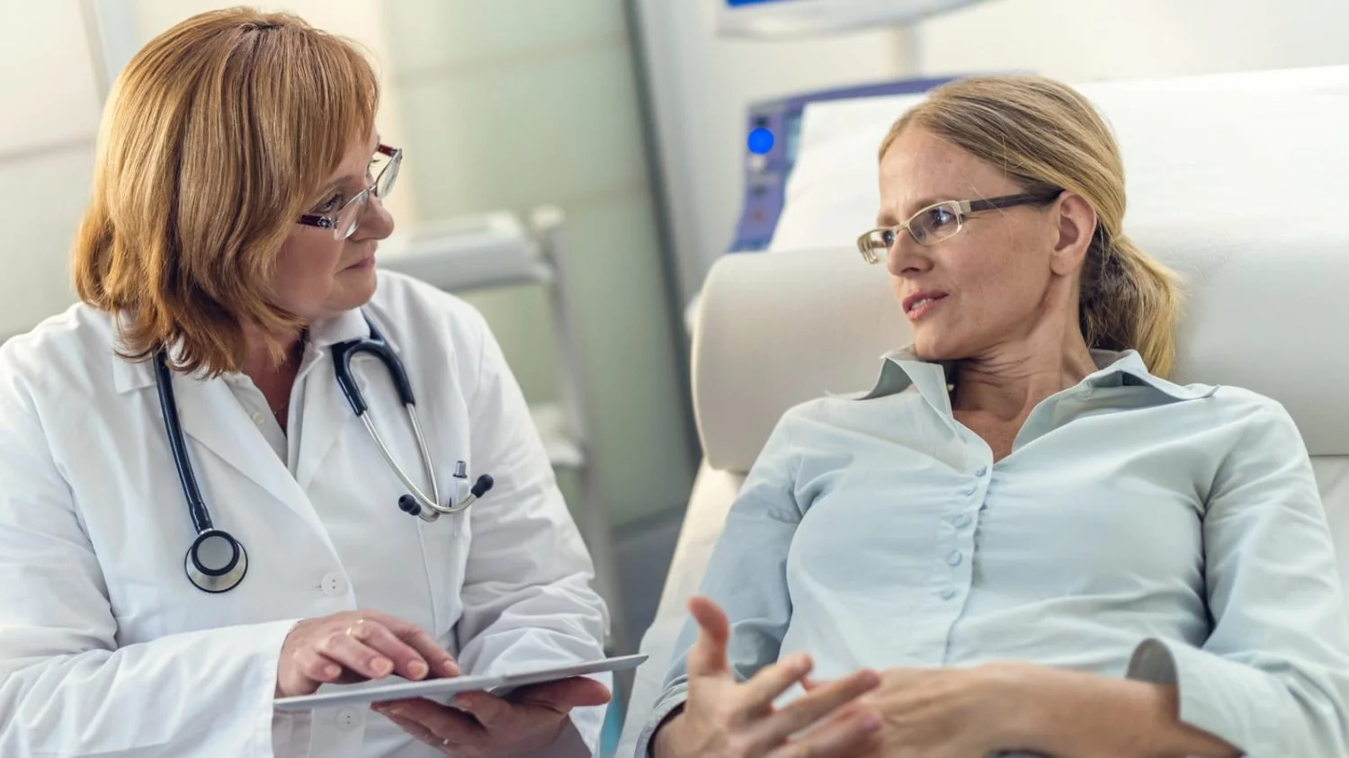 Female Doctor Meeting With Female Patient Stock Photo