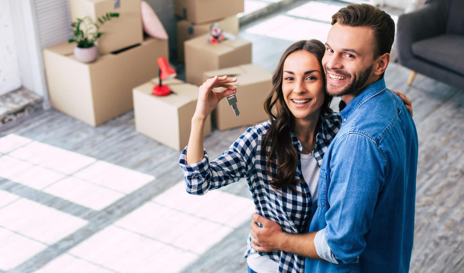 first-time homebuyers with the keys to their new Massachusetts home