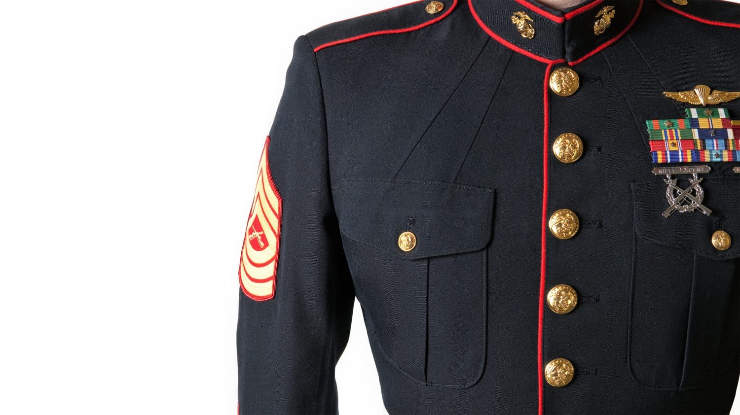 US Marine standing in uniform.