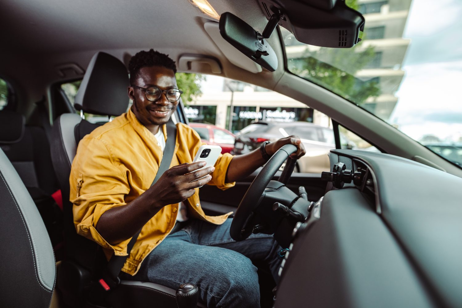 A Boston Lyft driver is checking their app to look for ride requests nearby.