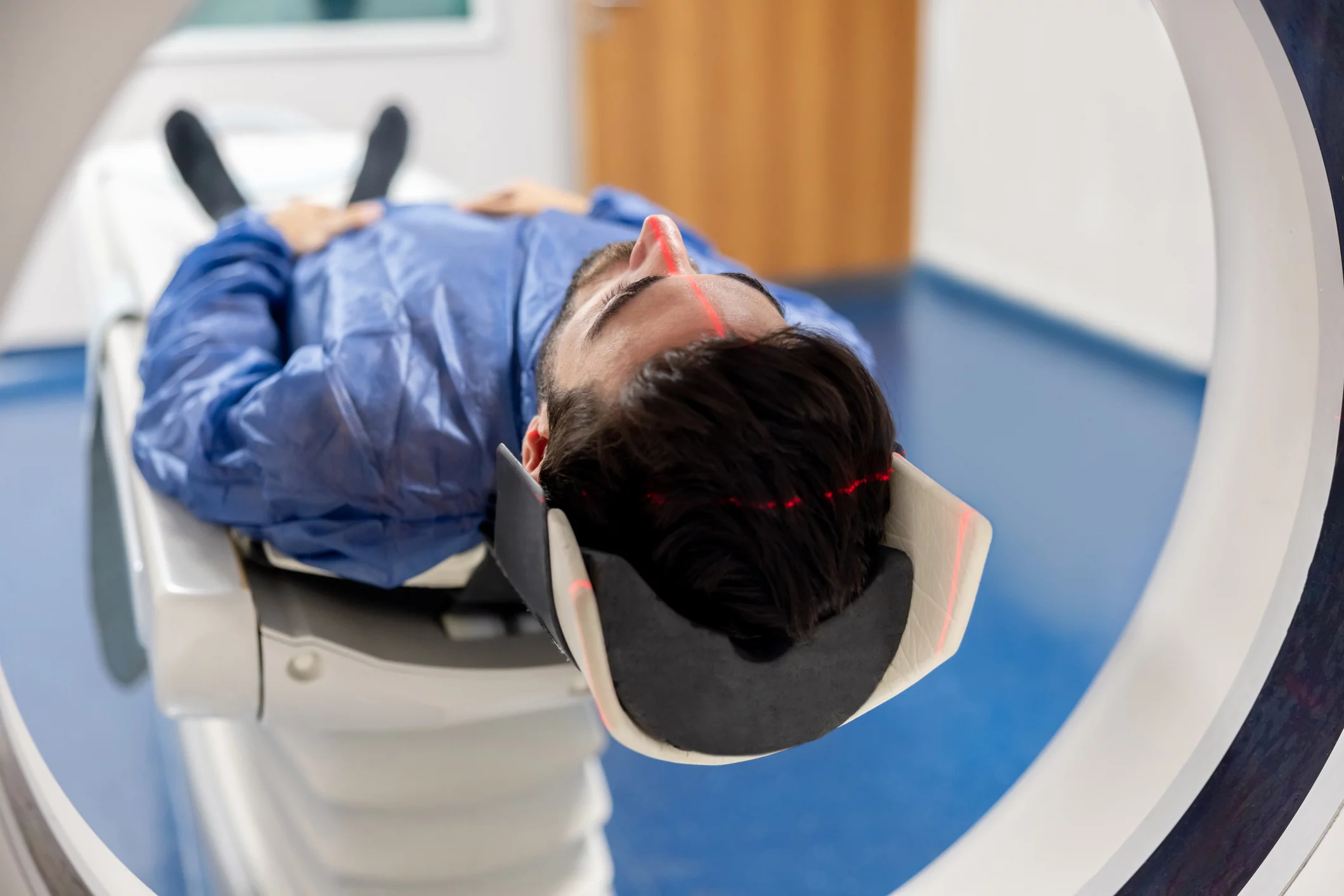 A patient is receiving a brain scan to determine the extent of a brain injury.