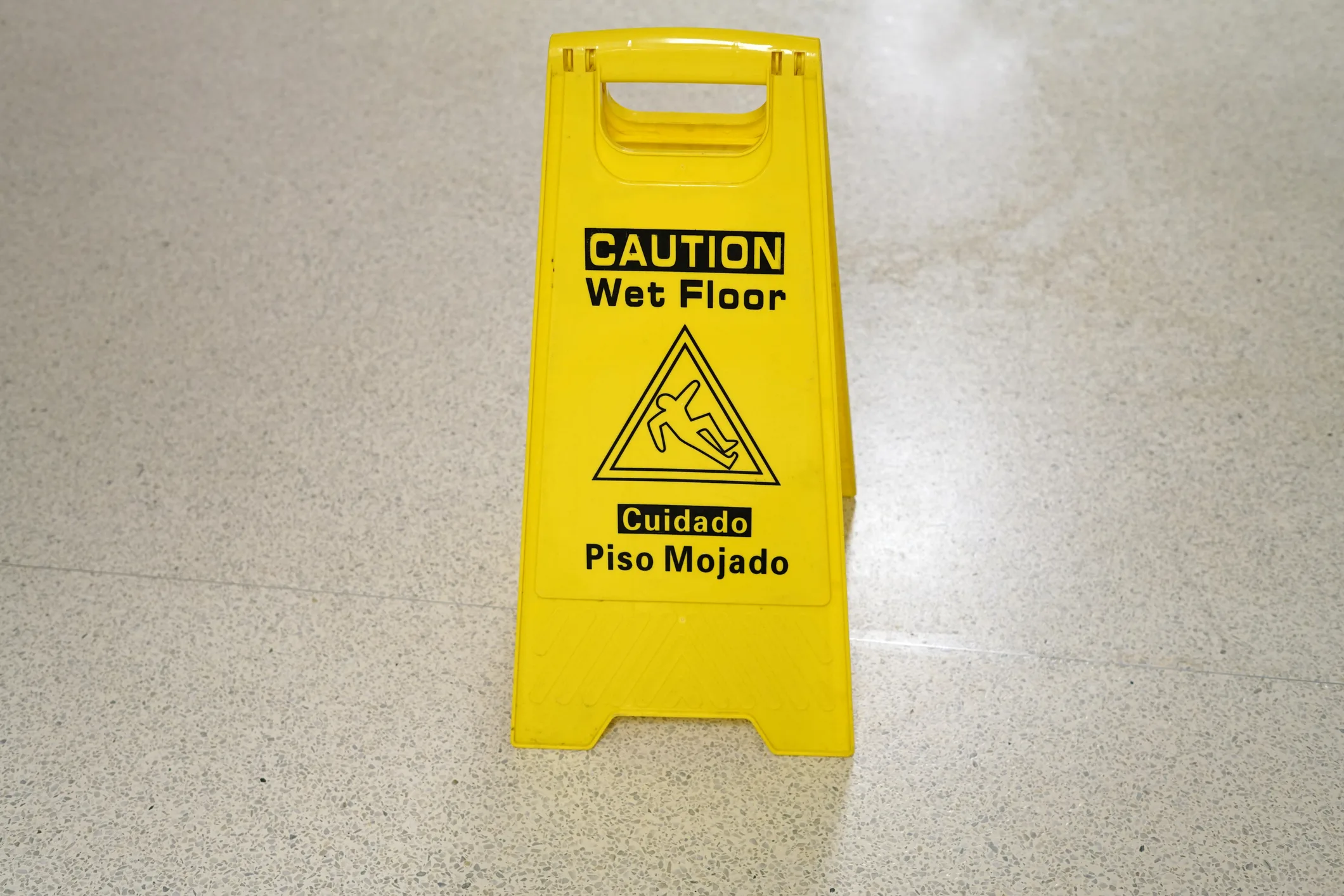 A yellow wet floor sign.