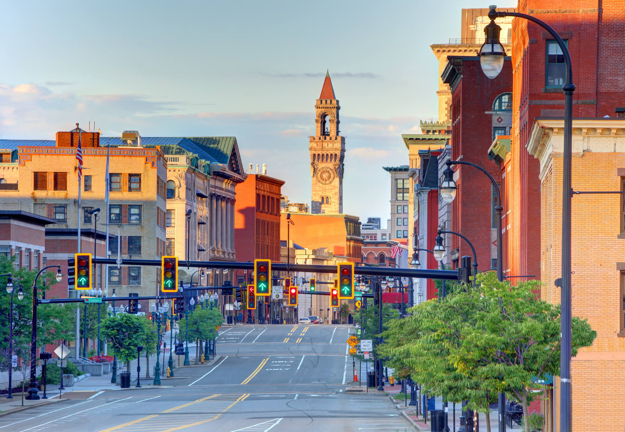 A street in Worcester, MA, with buildings and traffic lights.
